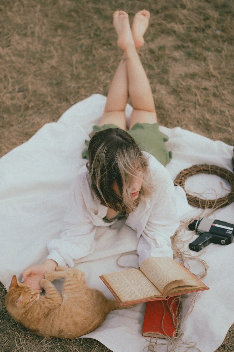 Woman With Cat And Book On Picnic