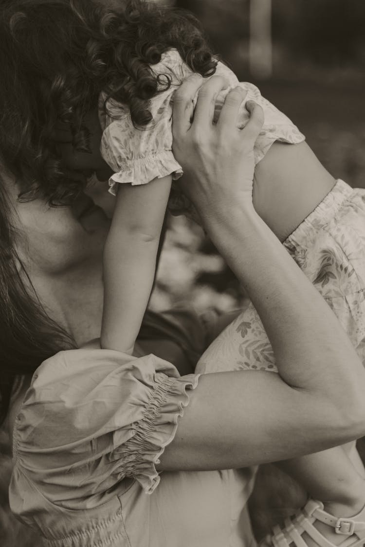 Mother Holding Daughter In Black And White