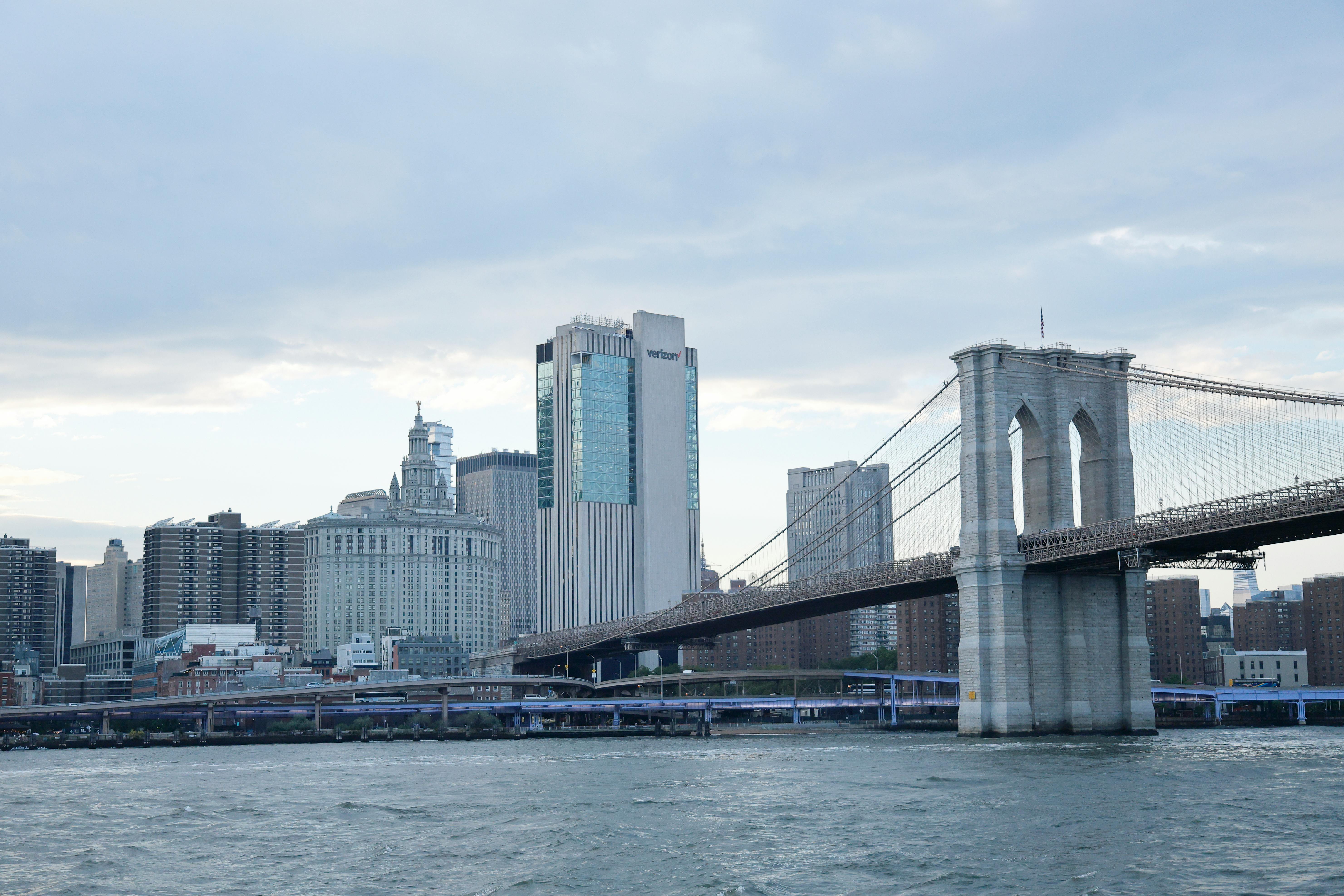 Old Brooklyn Bridge under white sky at sunset · Free Stock Photo