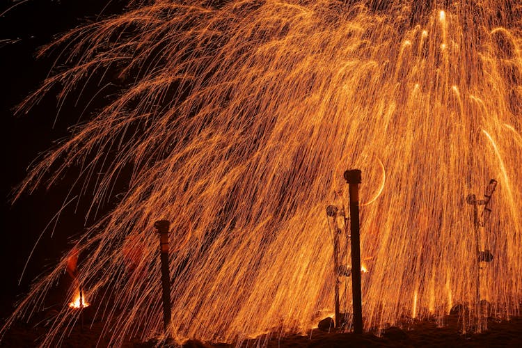 Sparks Shooting From Spinning Wheels At A Fire Show