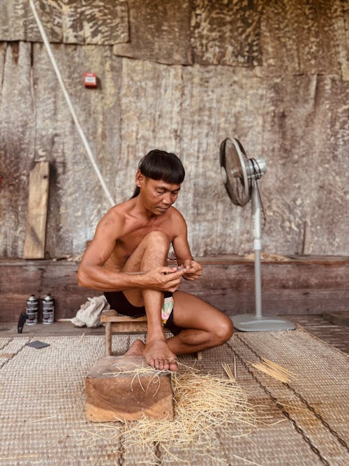 Shirtless Man in Sarawak Cultural Village in Malaysia