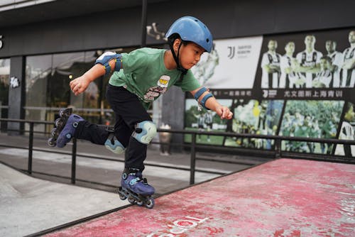 Boy Rollerskating in Skatepark
