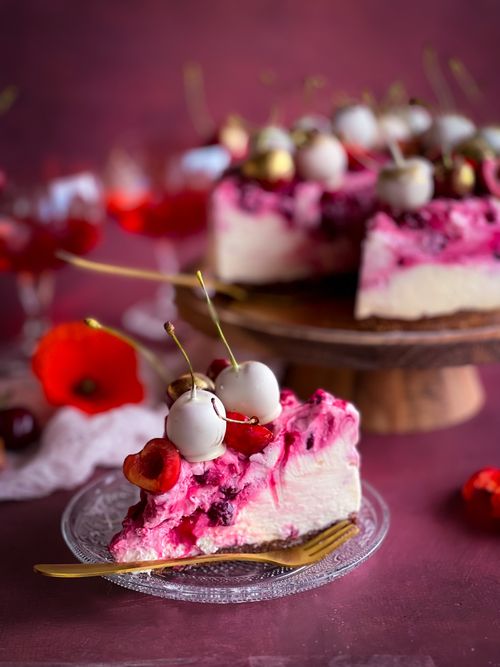 Free Delicious cherry cheesecake with vibrant pink cream and cherries, perfect for celebrations. Stock Photo