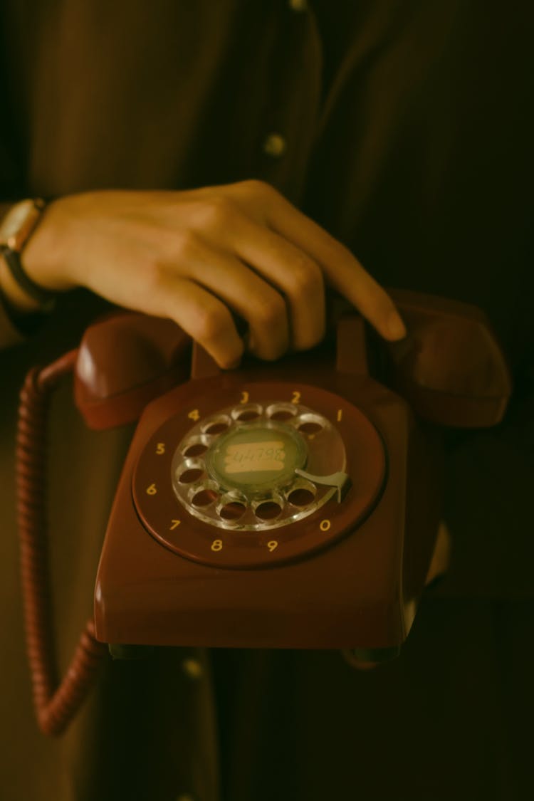 Close-up Of Woman Holding A Vintage Phone 