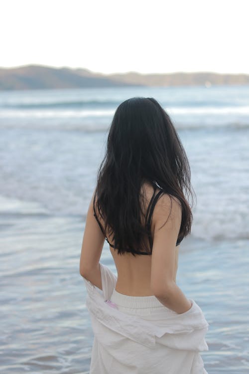 Young Woman Standing on Beach