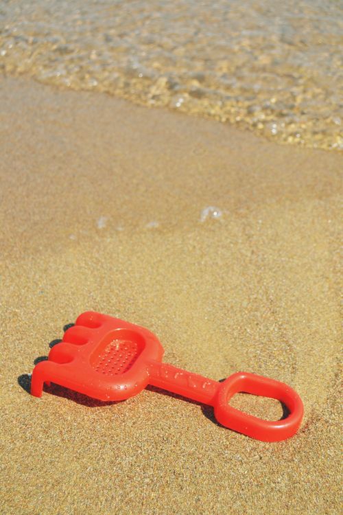 Red, Toy Rake on Shore · Free Stock Photo