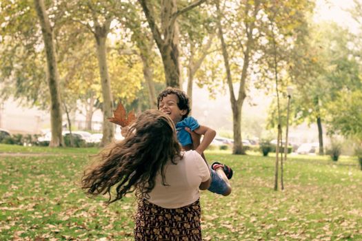 Mother Playing with Son in Park