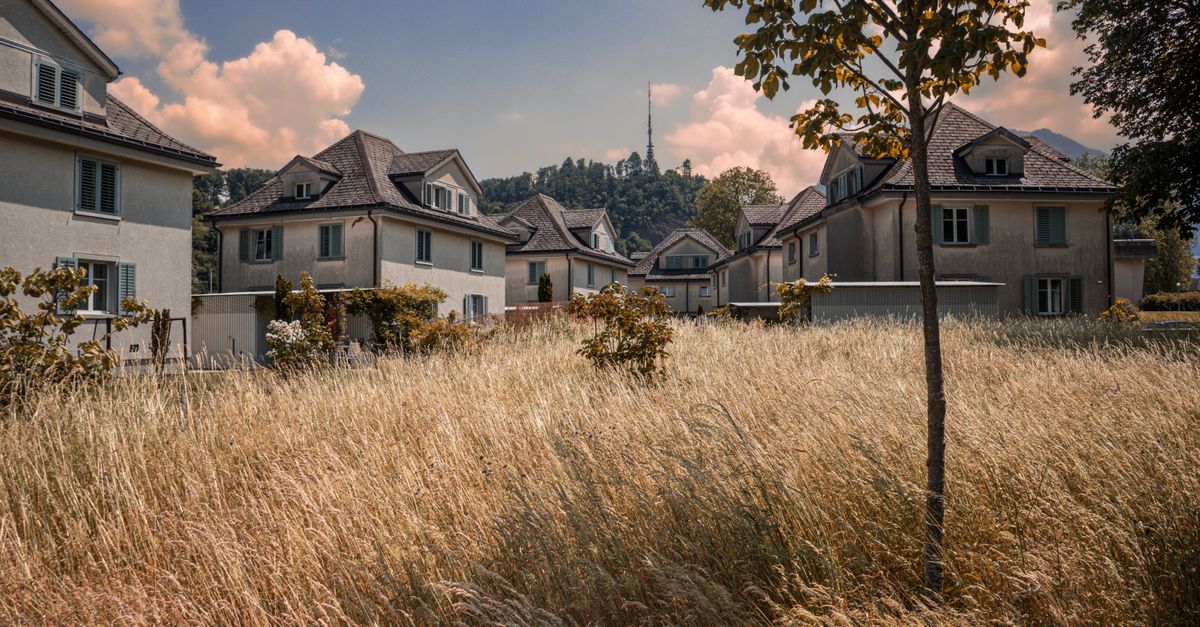 Picturesque houses in a serene residential area of Sankt Gallen, surrounded by nature.