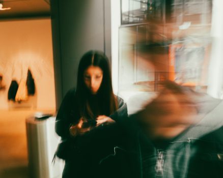 A creative long exposure shot capturing motion in an indoor setting with blurring effects.