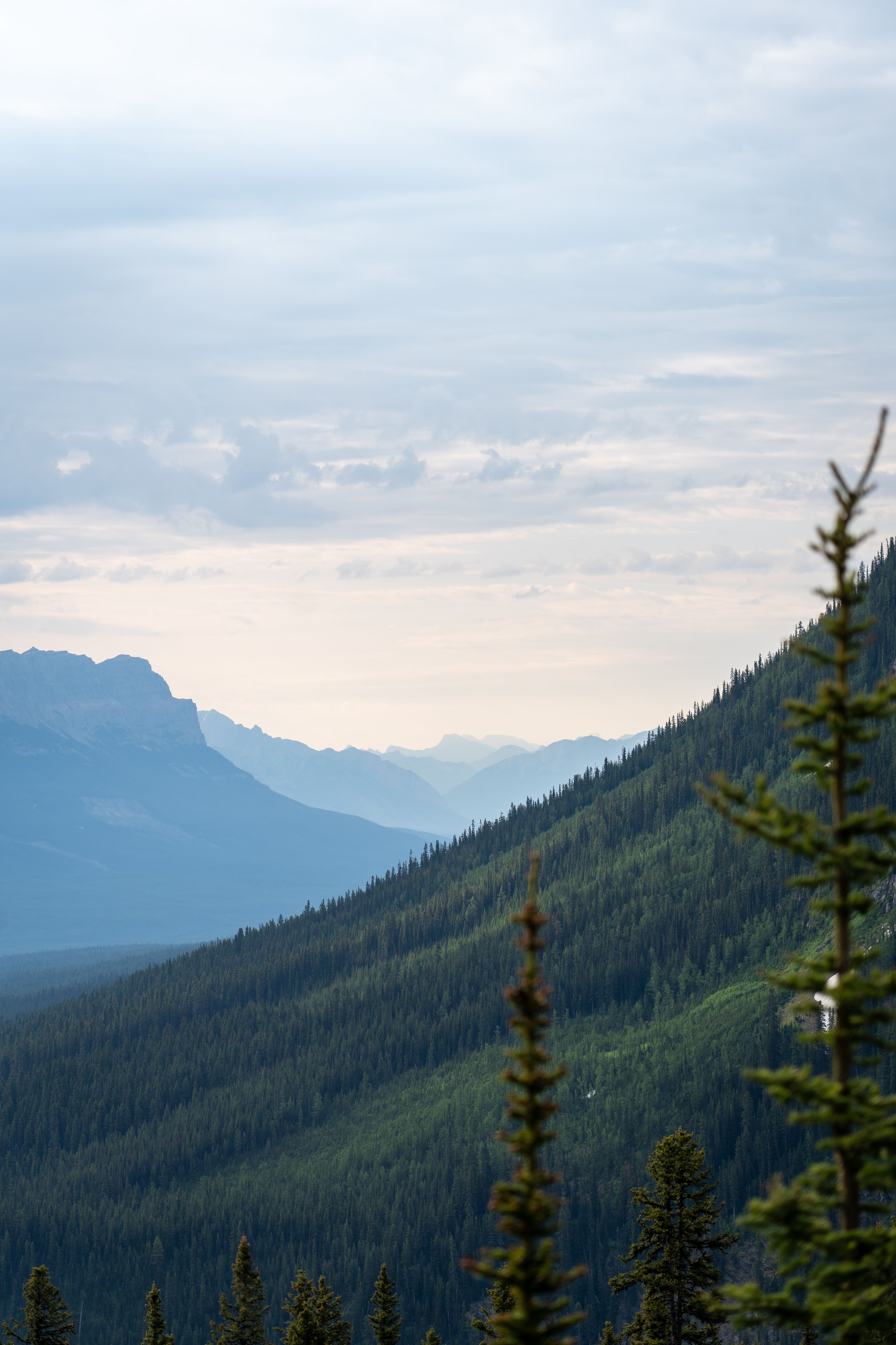 Sunrise over a quiet national park overlook with empty trail and distant mountains