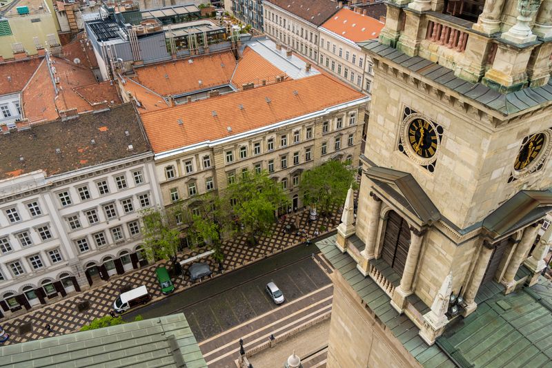 Elevated view of Budapest cityscape with historic architecture and bustling street.