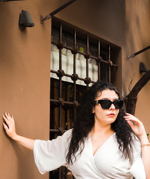 Woman in Sunglasses and White Clothes