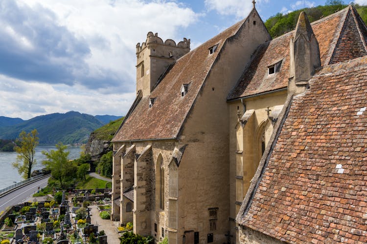 Church And Graveyard Near River In Town