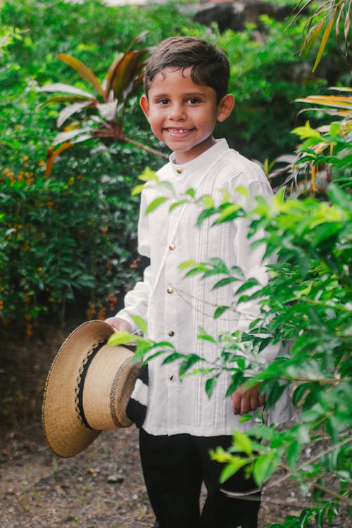 Smiling Boy Standing in the Garden