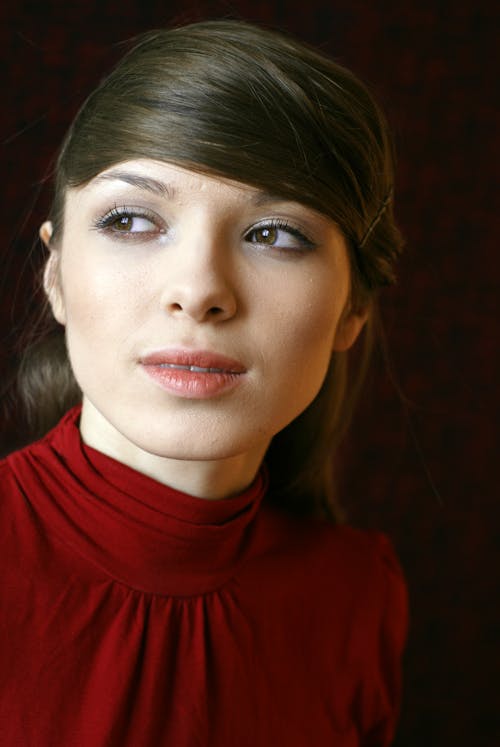Young Brunette Woman in a Red Blouse