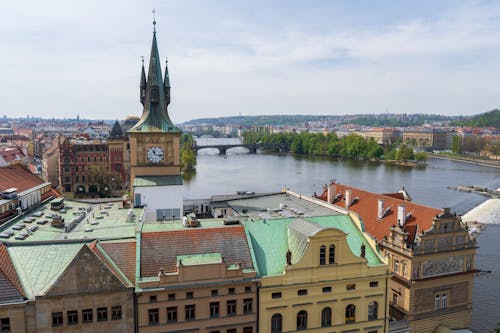 Prague Tenement Houses and the Clock Tower on the Vltava River Bank