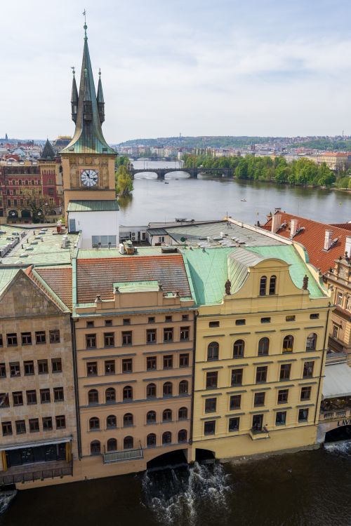 Free Aerial view of Prague showcasing historic towers and Vltava River in a vibrant cityscape. Stock Photo