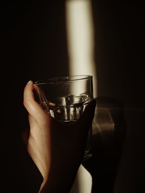 Free Hand Holding a Glass Stock Photo