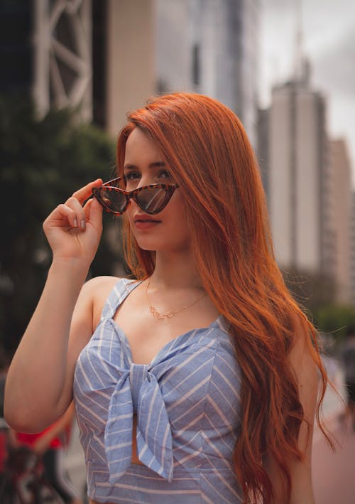 Free Photo of Woman Holding Her Sunglasses Stock Photo