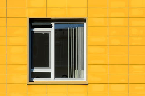 Window in Yellow Facade