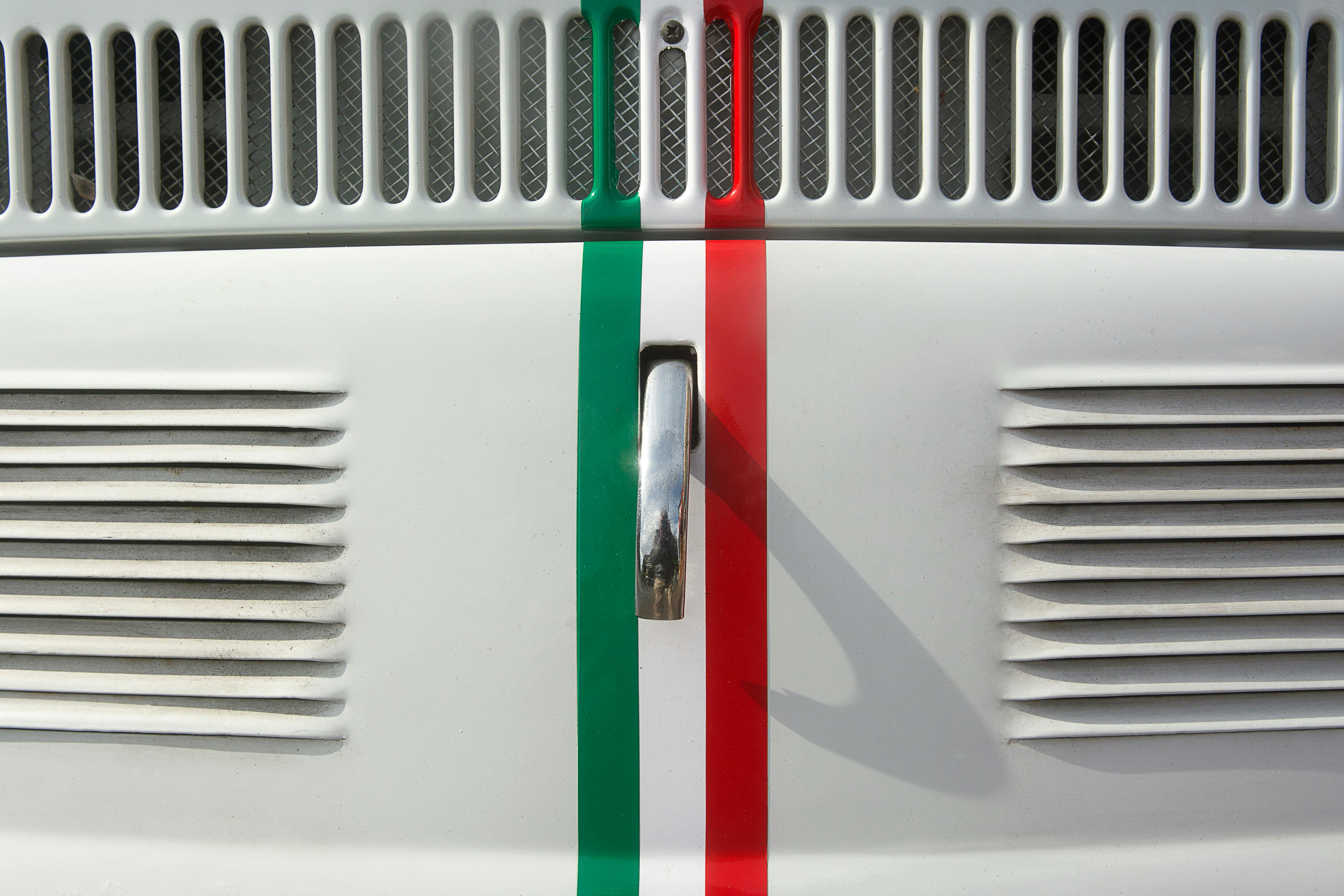 a close up of the front grill of a white car