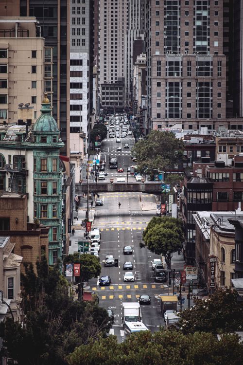 Free A bustling street scene showcasing the iconic architecture and vibrant life of San Francisco. Stock Photo
