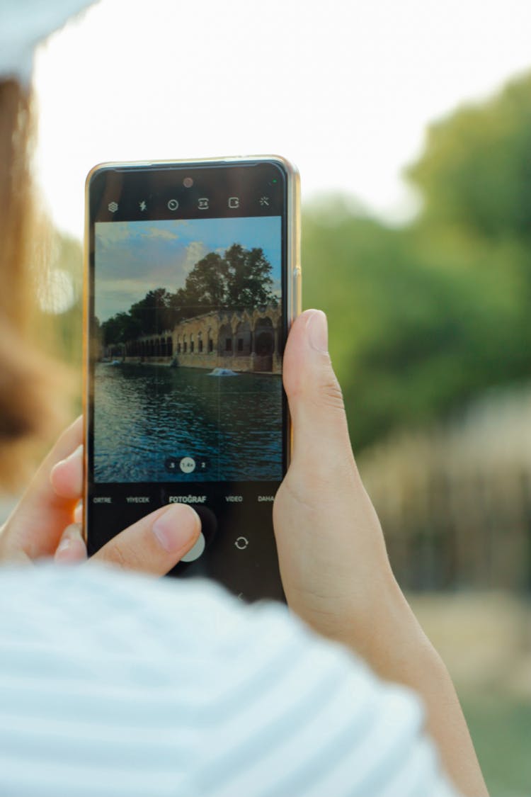 Person Taking A Photo With A Smartphone