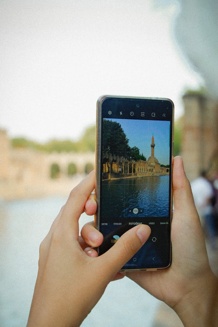 Person Taking Photo Of A Mosque With A Smartphone