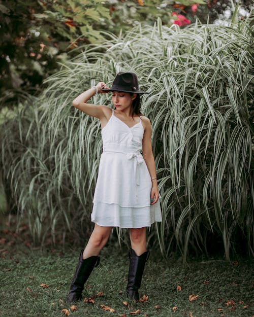 Woman in White Sundress and Cowboy Boots