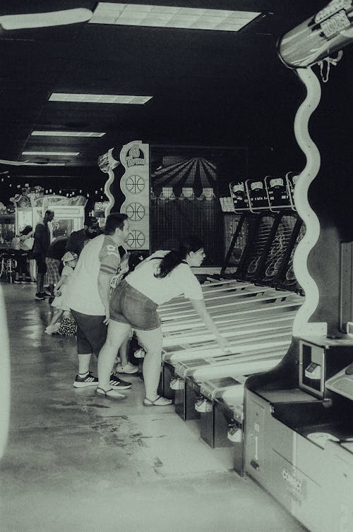 People Playing Arcade Games