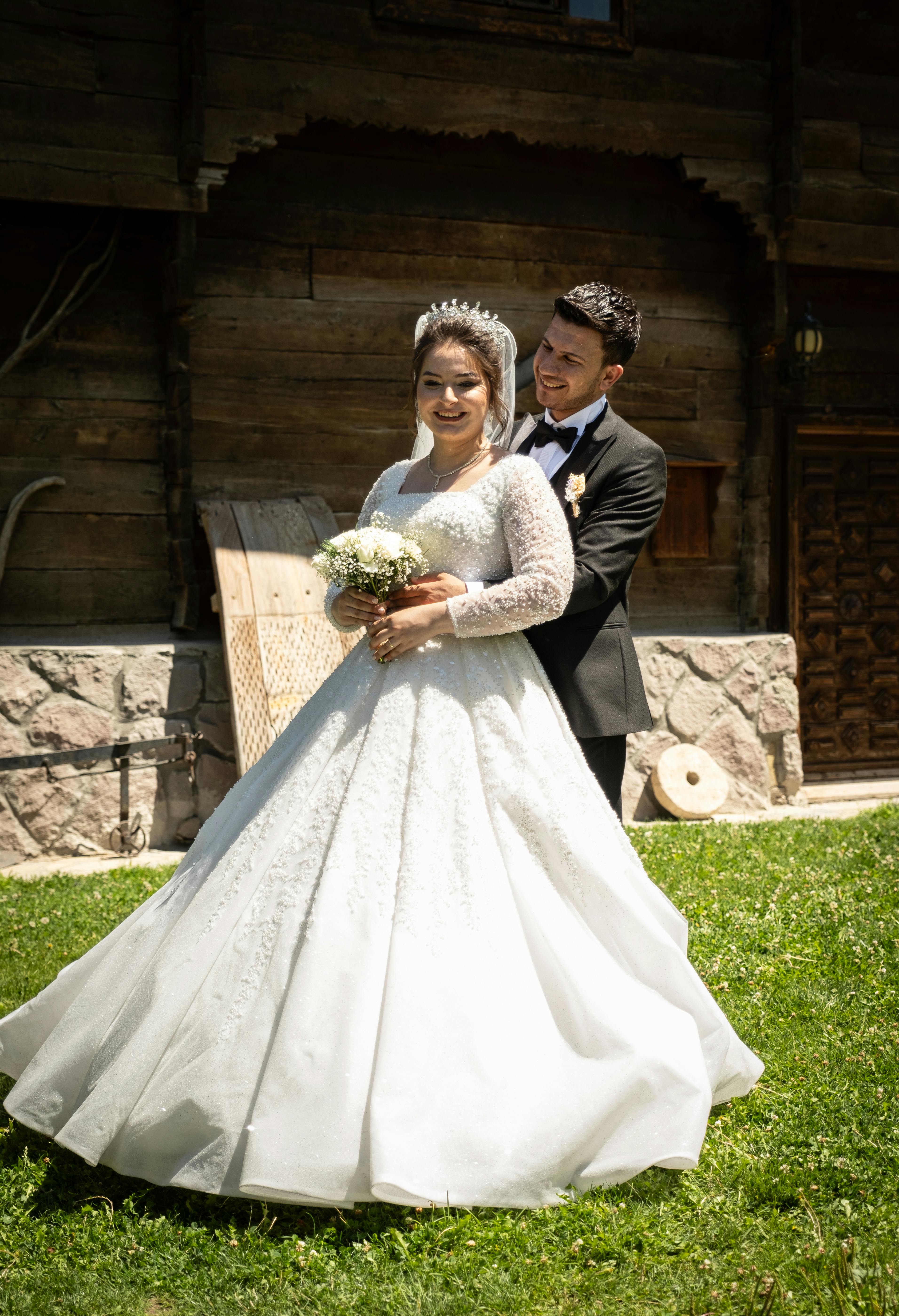 Man and Woman in Wedding Suit and Dress · Free Stock Photo