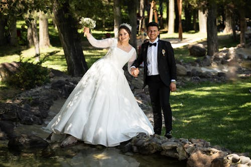 Bride and Groom Posing in a Park