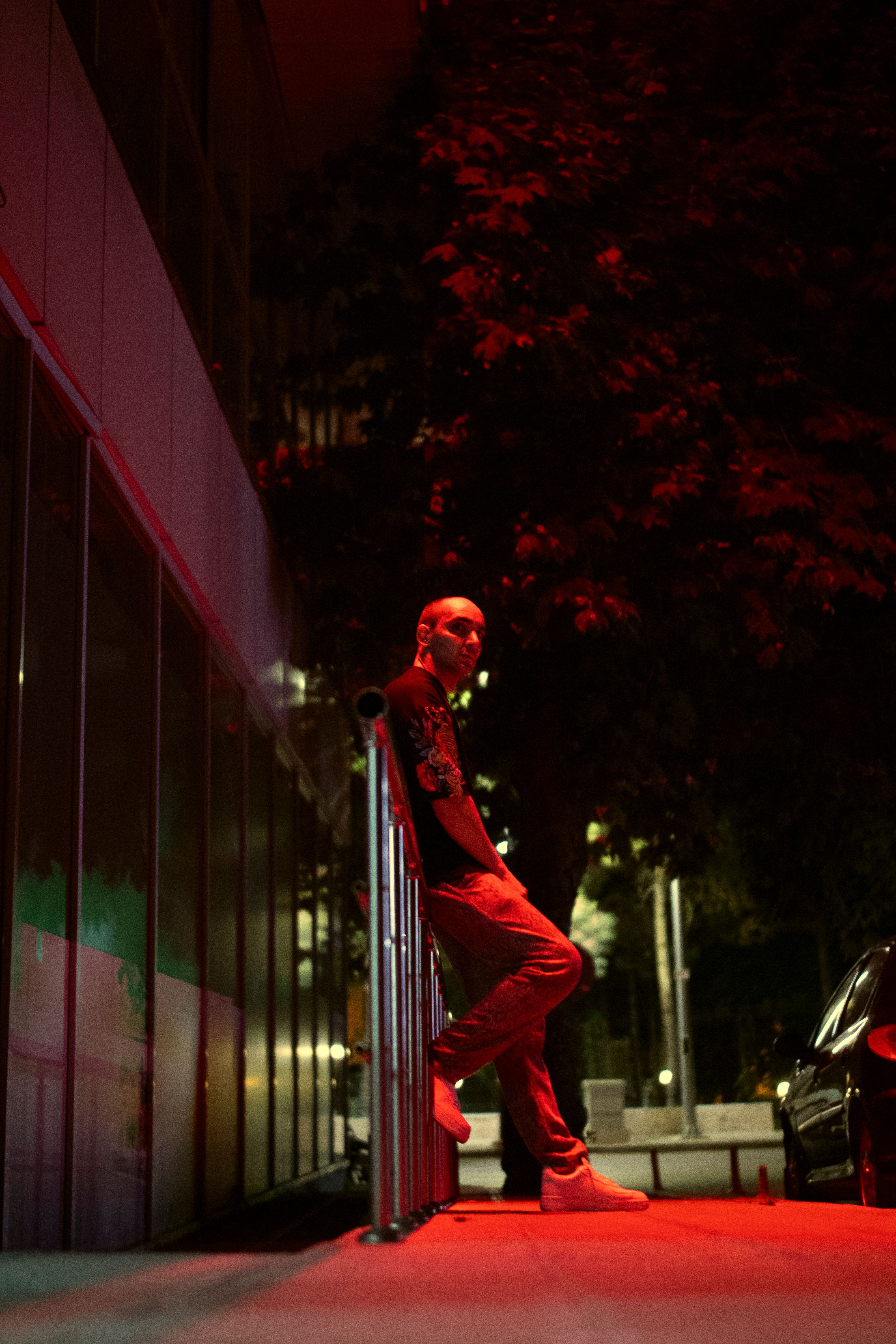 man-in-red-light-at-night-free-stock-photo
