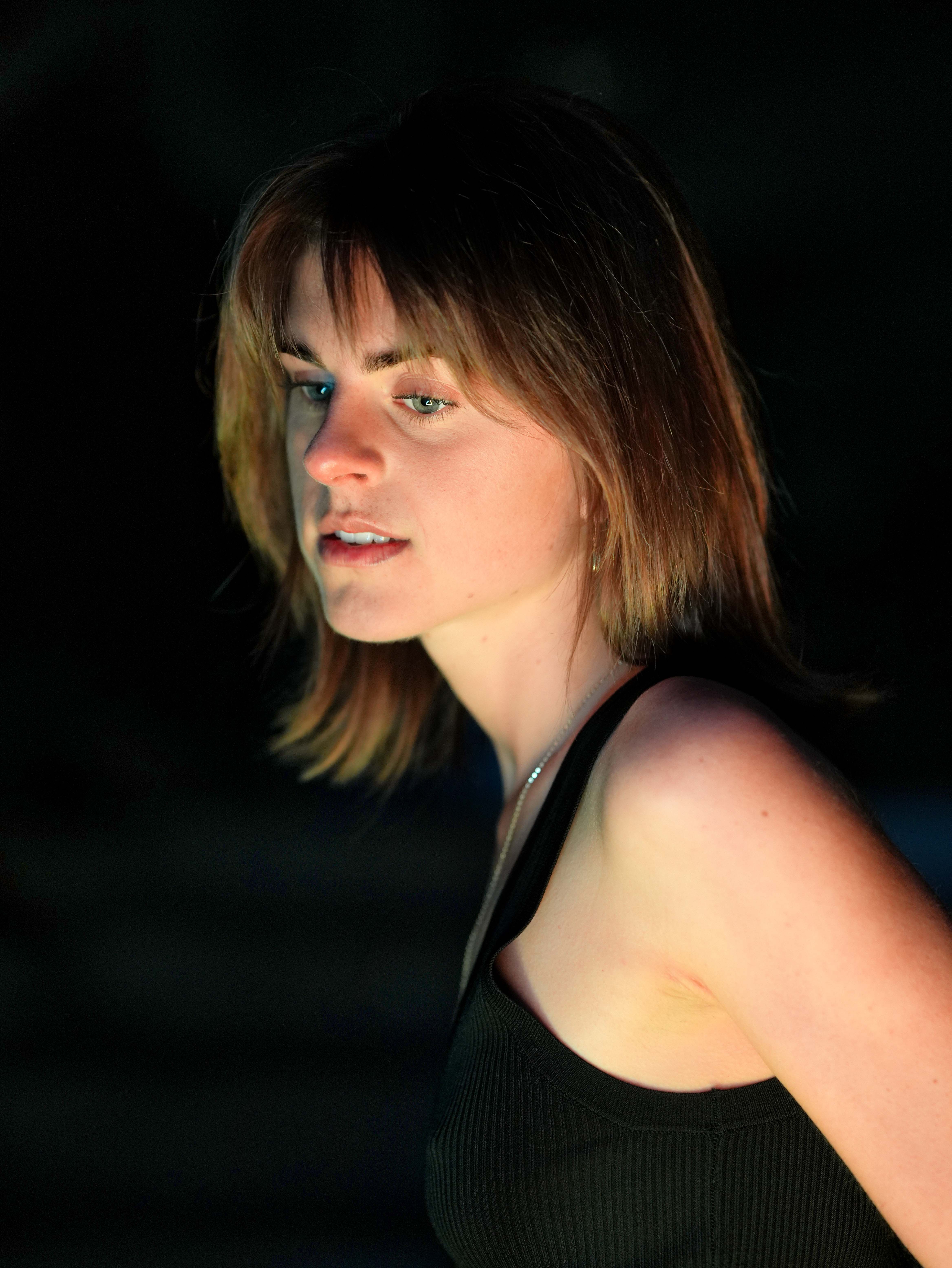Engaging portrait of a woman with brown hair, highlighting mood and expression.
