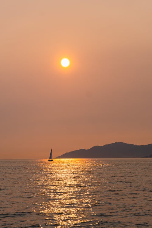 Sailboat on Sea Coast at Sunset
