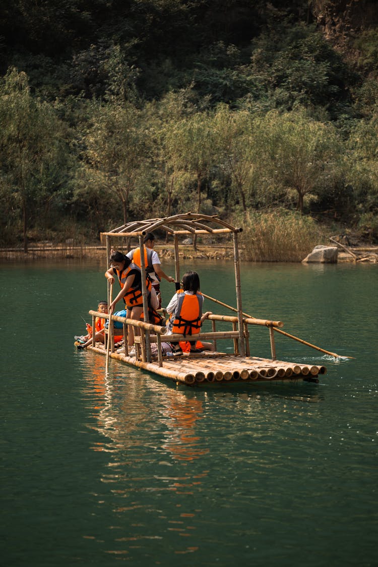 People Rafting On Water