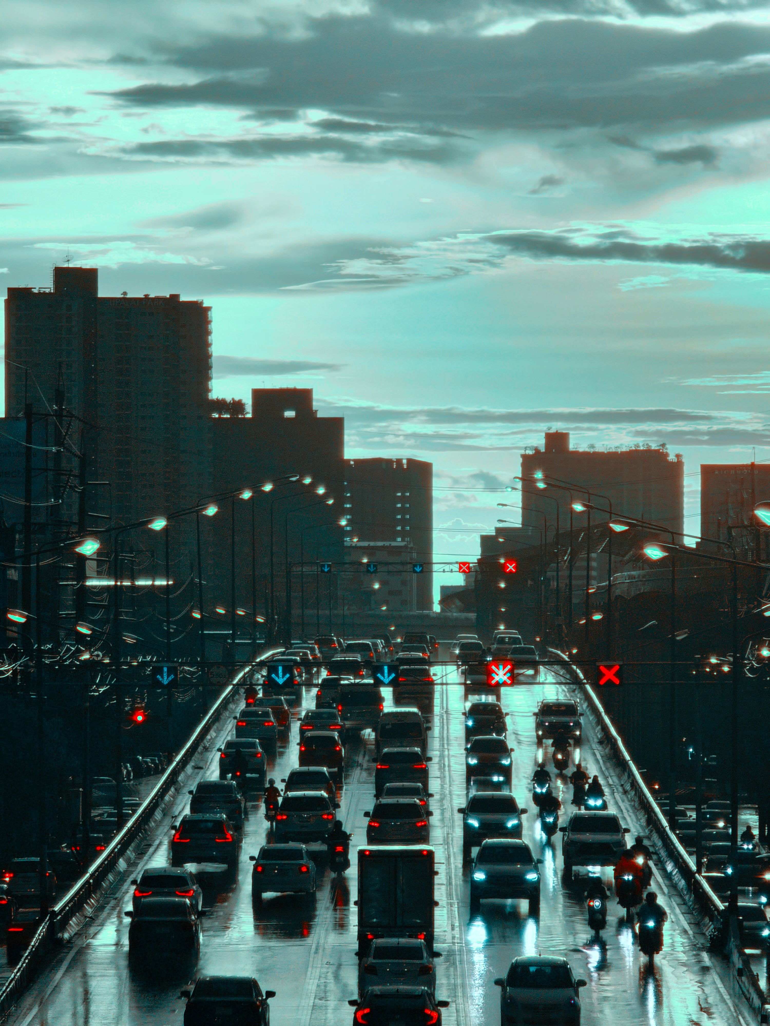 A city skyline with cars driving on a bridge · Free Stock Photo