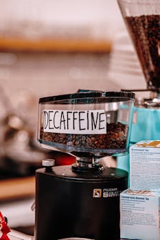Close-up of a decaffeinated coffee grinder in a Baku café, highlighting the beans and brewing atmosphere.