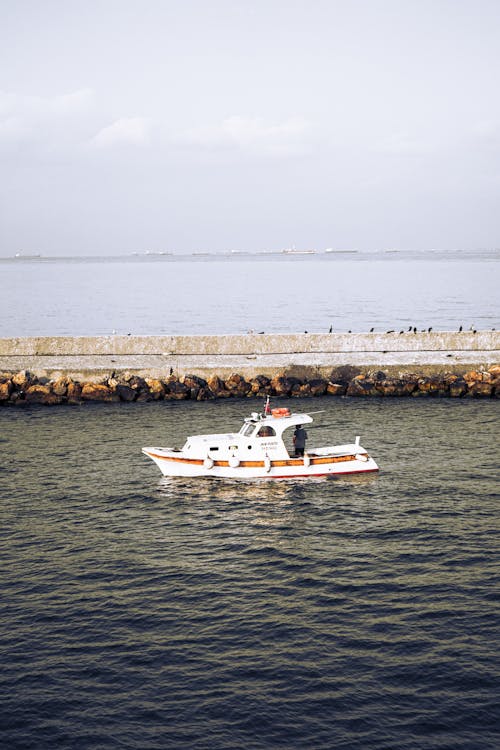 Motorboat on the Sea by a Pier