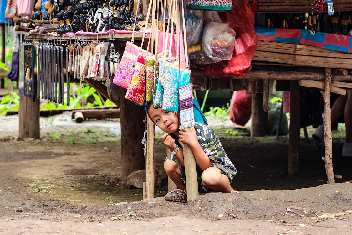 A Boy Sitting on the Ground