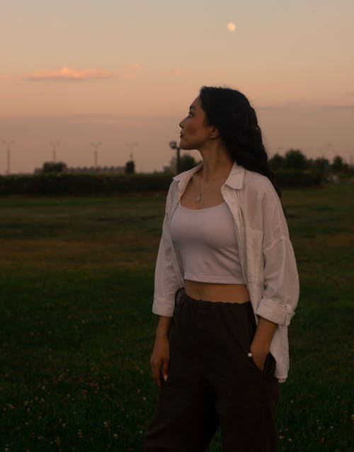 Woman in White Shirt at Dusk