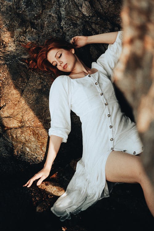 Portrait of a Pretty Redhead Wearing a White Dress