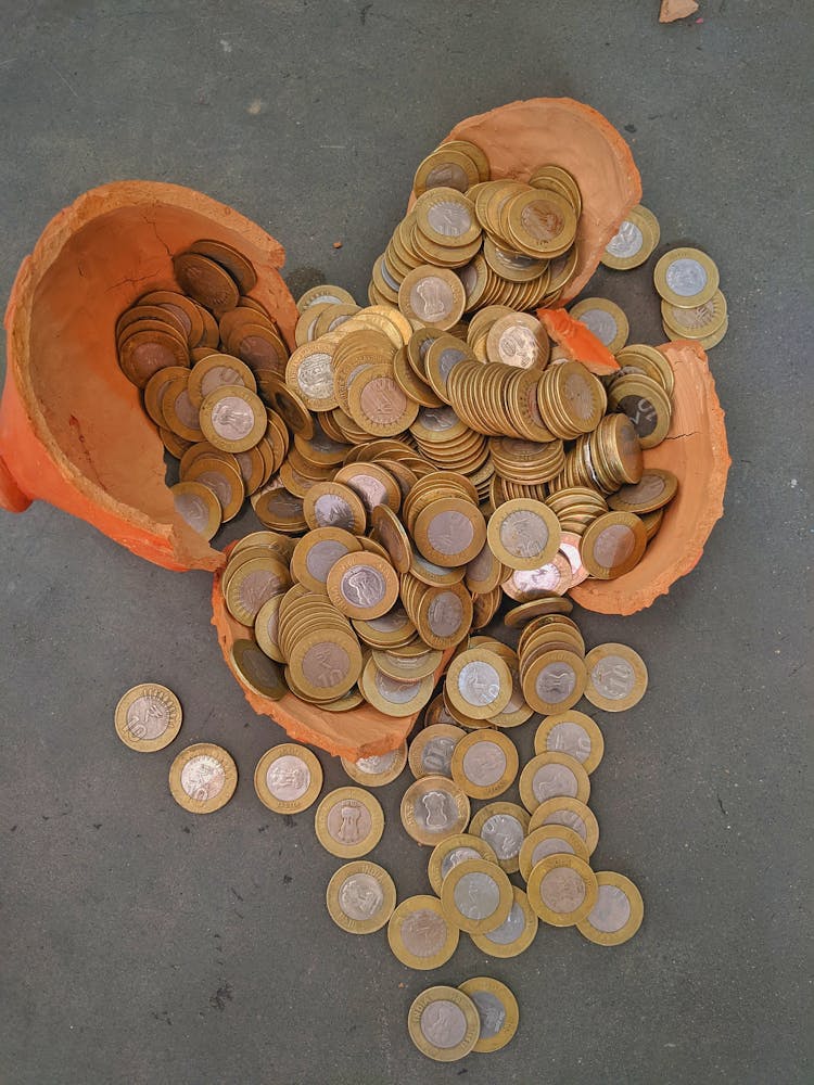 Rupee Coins In A Broken Piggy Bank