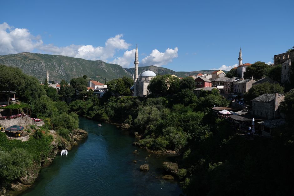 Train traveling through a scenic valley between Sarajevo and Mostar, Bosnia and Herzegovina