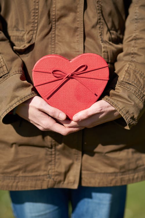 Free Person Holding Heart Shaped Gift Stock Photo
