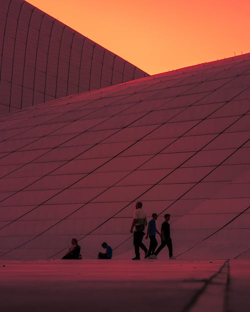 Pedestrian Walking by Heydar Aliyev Center in Baku