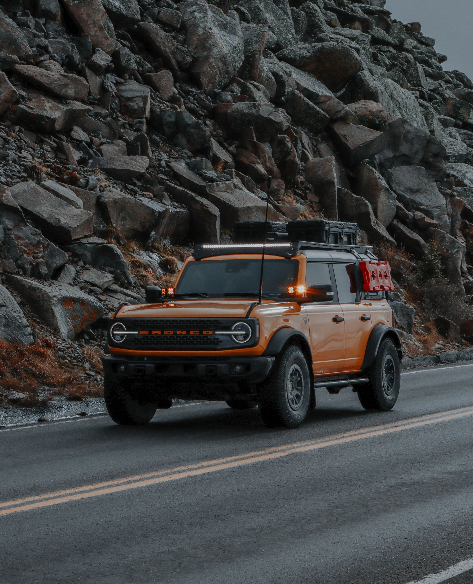 A customized Ford Bronco in an adventure setting best illustrates the program