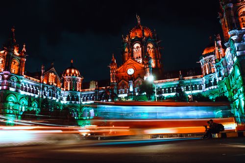 Free Illuminated Chhatrapati Shivaji Terminus in Mumbai at night with motion blur. Stock Photo