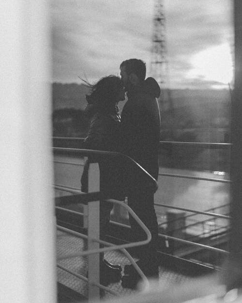 Couple Hugging on a Deck in Black and White