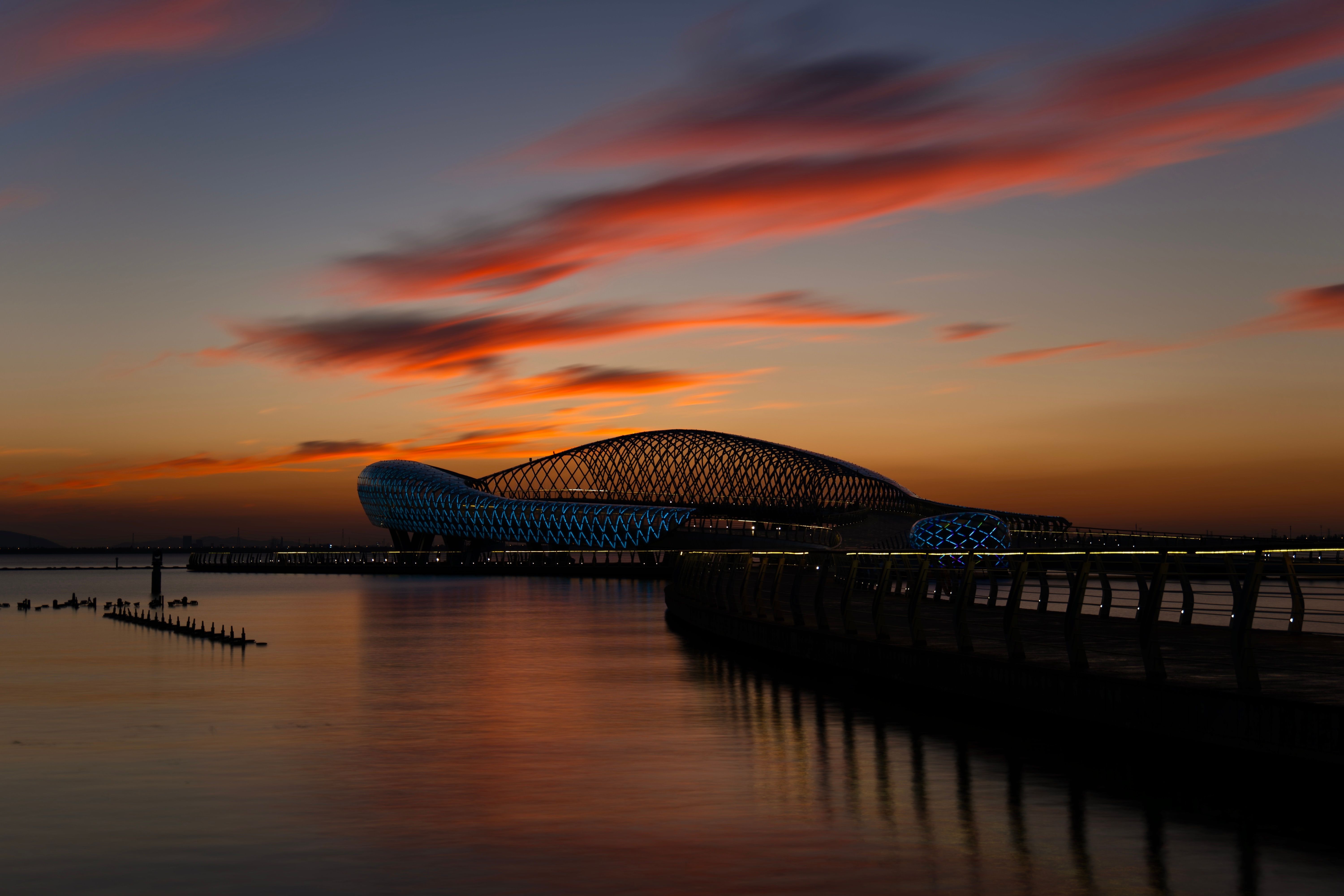 Pier and Modern Installation on Sea Coast and Sunset · Free Stock Photo